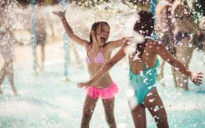 two girls playing at waterpark