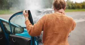 women getting out of car right after accident