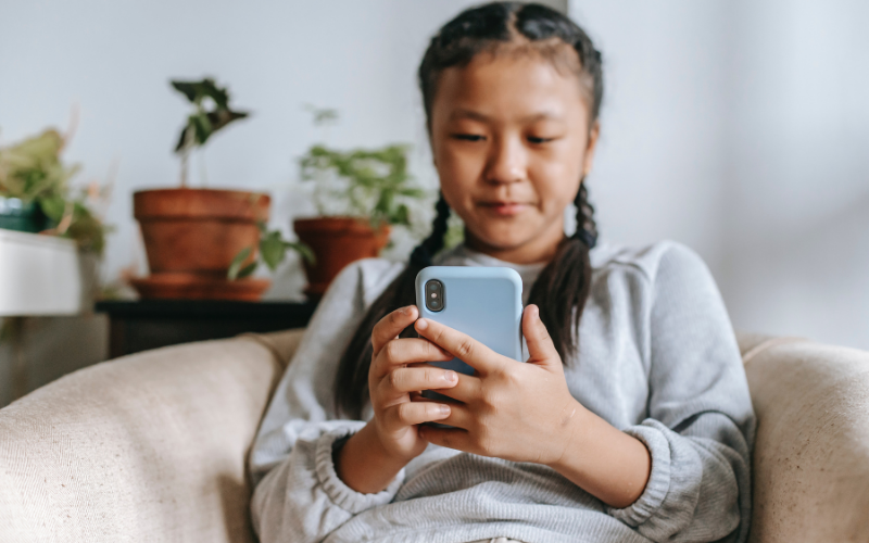 Little girl using phone