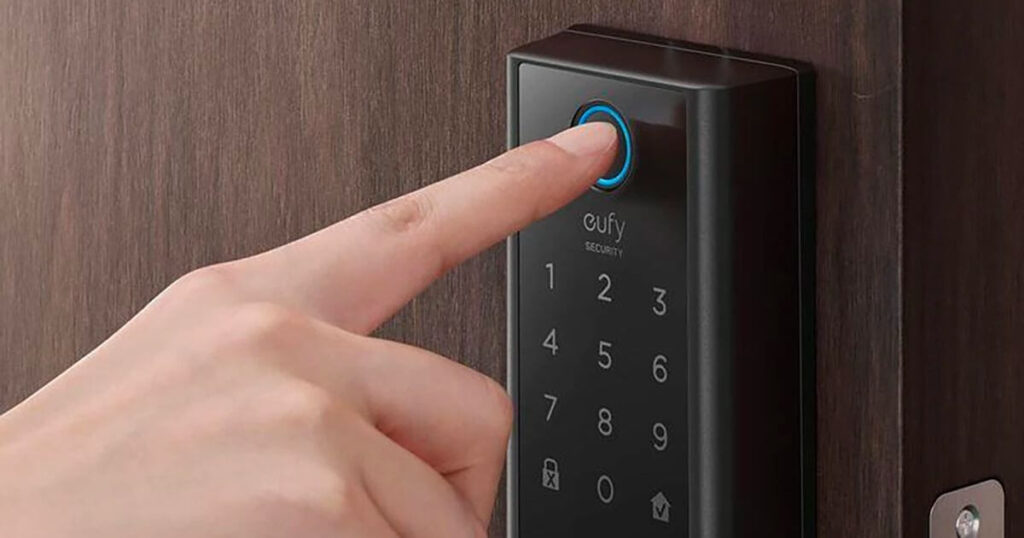 hand demonstrating fingerprint unlock feature on Eufy smart lock