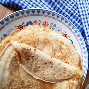 Pancakes on a blue plate. Photo by M Draa on Unsplash