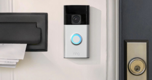 The new Ring Video Doorbell installed beside a door.