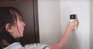 Katie McEntire installs SimpliSafe keypad