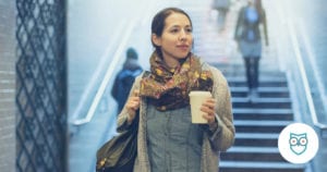 woman walking into a train station