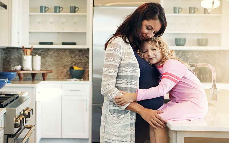 picture of pregnant mother with daughter