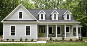 a family sitting down in a new home