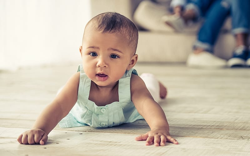 Baby playing on floor